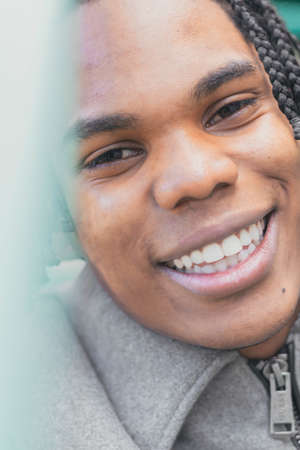 Portrait of a young black skinned man with afro hair