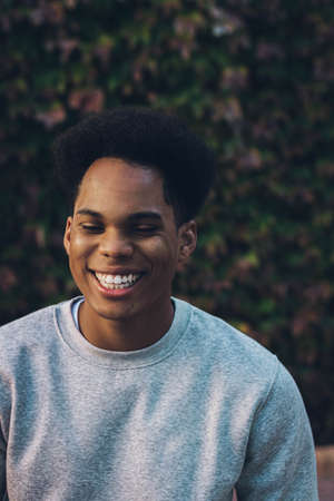 Portrait of a young black skinned man with afro hair