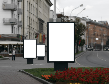 Three Blank Billboards on City Street . Clipping path.  Shallow depth of field.の写真素材