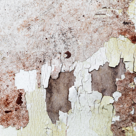 Peeling paint texture. Fragment of the old grunge wall, cracked over time.
