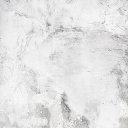 Rough cement plaster. Old grunge white wall texture background.の写真素材