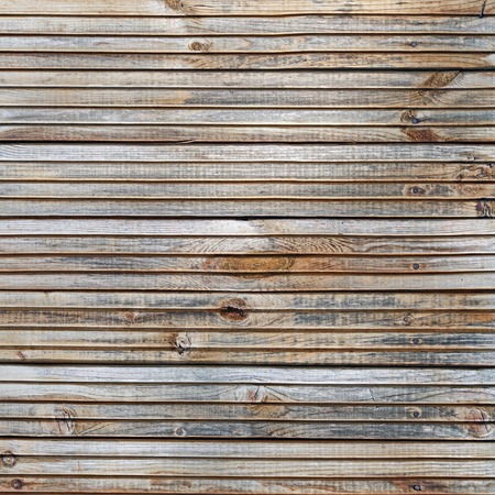 Wood plank texture. Weathered wooden background with knots and nails.