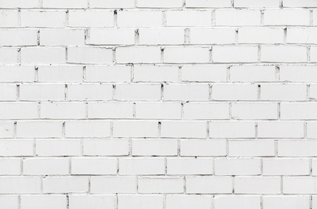 Fragment of old white brick wall for background or textureの写真素材