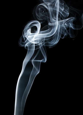 Photo of abstract smoke swirls on black background. Studio shot.の写真素材