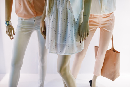 Fashion concept. Photo of elegant female legs mannequins showing clothing and accessories. Shallow depth of field. Selective focus.の写真素材