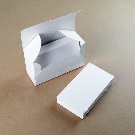 A box with blank business cards and a stack of business cards.  For design presentations and...