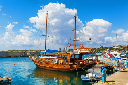 NESEBAR, BULGARIA, SEPTEMBER 06, 2013: Pleasure yacht in the port of Nesebar old town. Wooden passenger sailing ship standing at the pier on the coast of the Black Sea.のeditorial素材