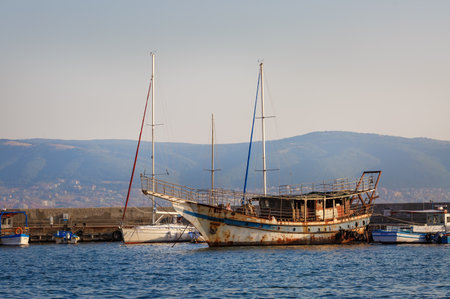 Nesebar, Bulgaria - September 10, 2014: Old rusty ship at the dock in the port of the old town of Nessebar, on the Black Sea coast.のeditorial素材
