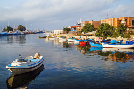 Nesebar, Bulgaria - September 05, 2014: Fishing boats at the pier in the harbor of the old town of Nessebar, Bulgaria. Old Nesebar is an ancient town on the Bulgarian Black Sea Coast.のeditorial素材