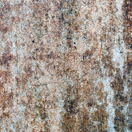 Peeling paint texture with cracks and rust spots. Rusty metal background.