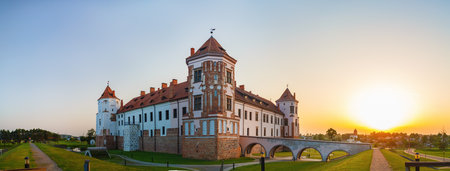 Mir, Belarus - August 11, 2016: Medieval castle in Mir, Belarus. Ancient fortress with towers at sunset. UNESCO World Heritage. Panoramic shot.のeditorial素材