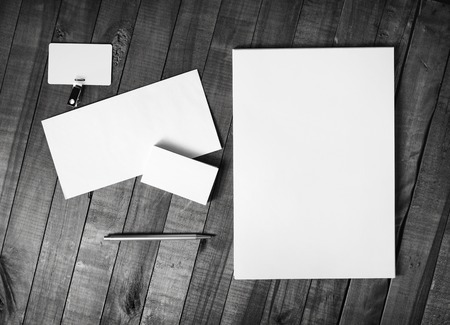 Photo of blank corporate stationery template on wood background. Brand ID set. Top view.の写真素材