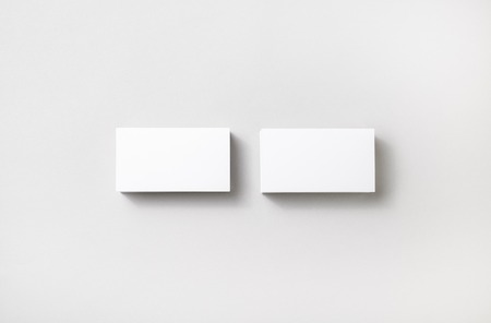 Blank business cards on paper background. Template for branding identity. Studio shot.の写真素材