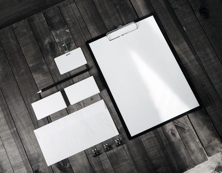 Blank stationery set on on wooden table background. Template for branding identity. For graphic...