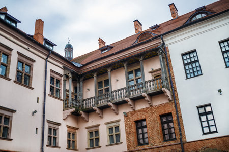 Mir, Belarus - August 04, 2017: Facade of ancient building, balcony and windows in ancient medieval castle in Mir, Belarus.のeditorial素材