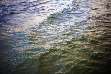 Sea waves background. Ocean water on a cloudy windy day. Top view.の写真素材