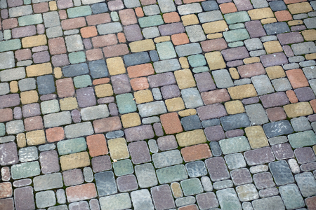 Multicolored paving slabs. Pavement background. Cobblestone textureの写真素材