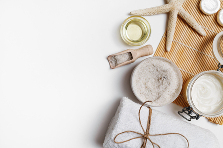 Spa cosmetic background. Treatment products on white paper background. Space for text. Flat lay.の写真素材