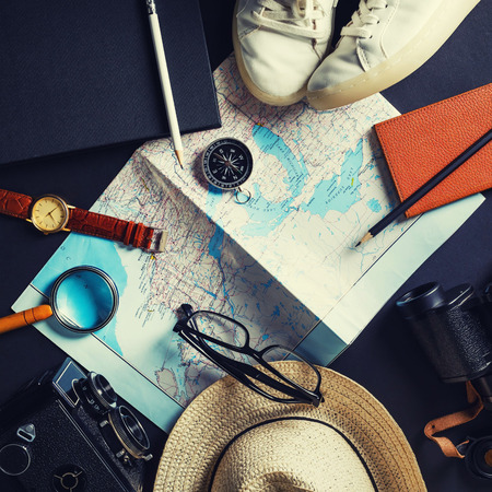 Planning vacation trip with map. Travel or vacation concept. Flat lay.の写真素材