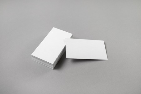 Blank business cards on gray paper background. Mockup for branding identity for designers.