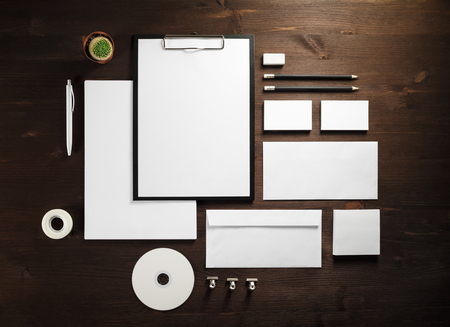 Branding mock up. Photo of blank corporate stationery on wooden background. Flat lay.の写真素材