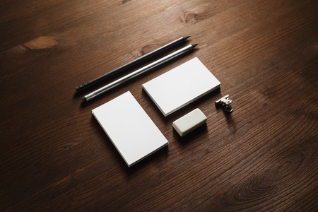 Branding stationery set. Blank business cards, pencil and eraser on wooden background. ID mockup....