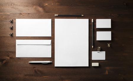 Blank corporate stationery set on wooden background. Branding mock up. Flat lay.の写真素材