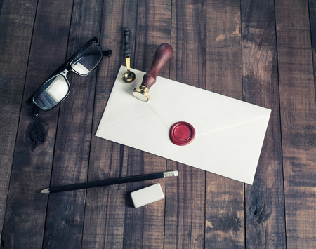 Vintage envelope and postal stationery on wooden background. Flat lay.の写真素材