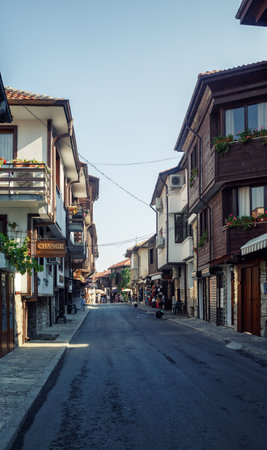 Nesebar, Bulgaria - September 10, 2014: Asphalt street and ancient architecture in old town Nessebar, Bulgaria. UNESCO world heritage site. Vertical shot.のeditorial素材