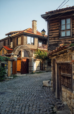 Nesebar, Bulgaria - September 10, 2014: Ancient architecture: houses and stone pavement of old town Nessebar, Bulgaria. UNESCO world heritage site. Vertical shot.のeditorial素材