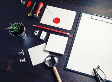 Blank stationery set on wooden background. ID template. Mock-up for branding identity for designers.の写真素材
