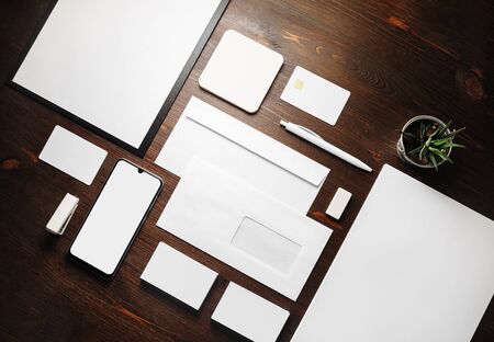 Stationery mock up. Blank corporate identity template on wood table background. Responsive design...