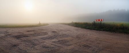 Gravel road and fog. Rural landscape. Panoramic shotの写真素材