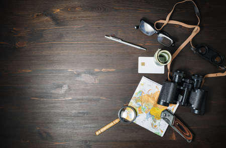Travel plan background. Traveler accessories and items on wooden background. Copy space for your text. Top view. Flat lay.の写真素材