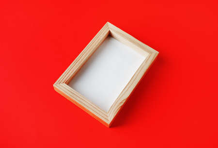 Photo frame on red paper background. Responsive design template.の写真素材