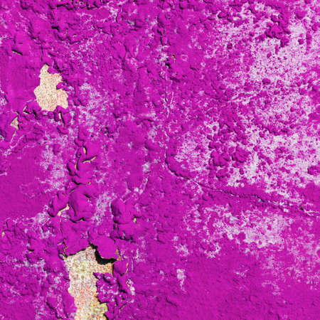 Old bright pink grunge material. Peeling paint and rust stains.の写真素材