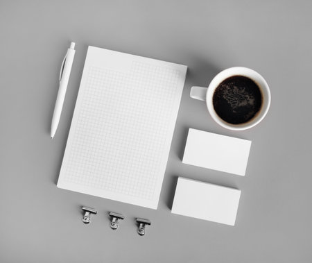 Blank corporate stationery set on gray paper background. Template for branding identity. Top view. Flat lay.の写真素材