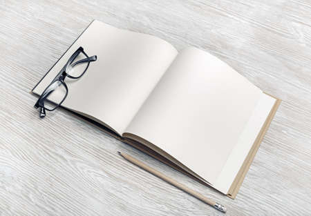 Photo of blank brochure, pencil and glasses on light wooden background. Responsive design mockup. Stationery elements. Template for placing your design.の写真素材