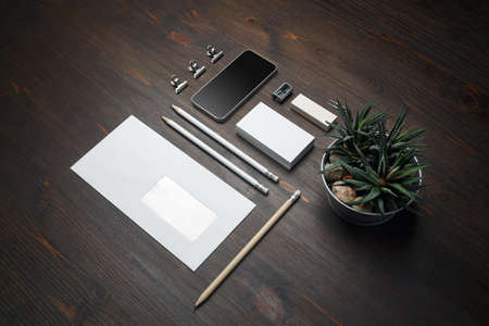 Stationery mock up. Blank corporate identity template on wood table background. Responsive design mockup.の写真素材