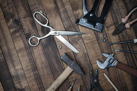 Different old tools on vintage wooden background. Flat lay.の写真素材
