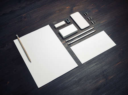 Photo of blank stationery set on wooden background. Mockup for design presentations and portfolios.の写真素材