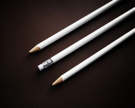 Photo of three simple blank pencils on dark background.の写真素材