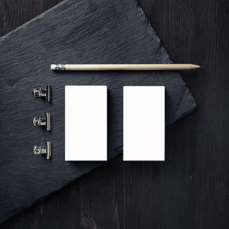 Blank business cards, pencil and clips. Branding mock up. Top view. Flat lay.