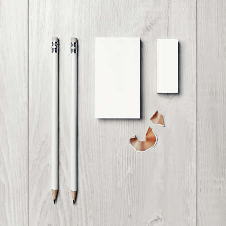 Photo of blank business card, pencils and eraser. Branding identity template. Top view. Flat lay.の写真素材