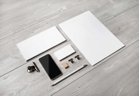 Blank corporate stationery set on light wooden background. Template for branding design. Branding mockup.の写真素材