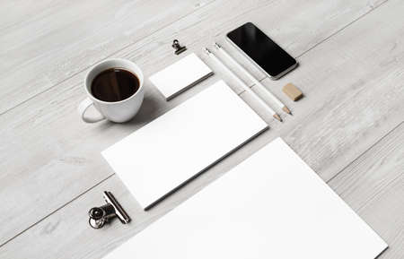 Photo of blank branding stationery template on light wooden background. Responsive design mockup.の写真素材