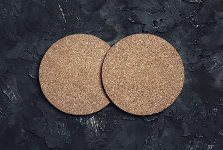 Photo of two blank cork beer coasters. Blank template for your design. top view.の写真素材