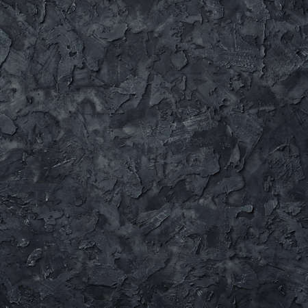 Black plaster texture. Black stucco wall background. top view.の写真素材