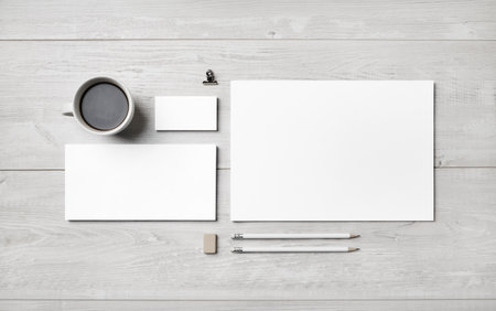Blank corporate stationery set on light wooden background. Template for branding identity. flat lay.の写真素材