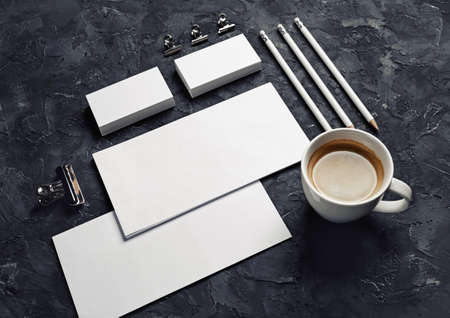 Blank stationery and corporate identity template on black plaster background. Responsive design mockup.の写真素材